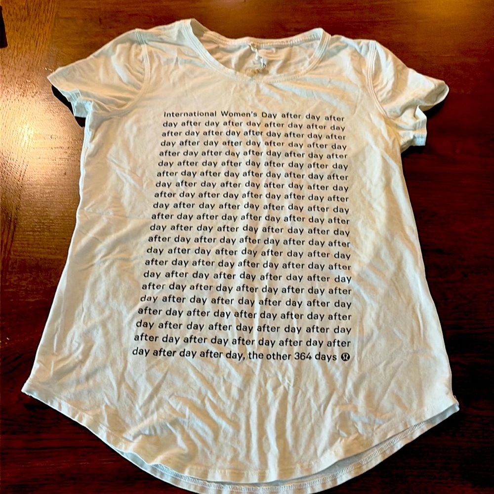 LULULEMON Rare International Women’s Day Size 4 White w/Black writing Love Tee